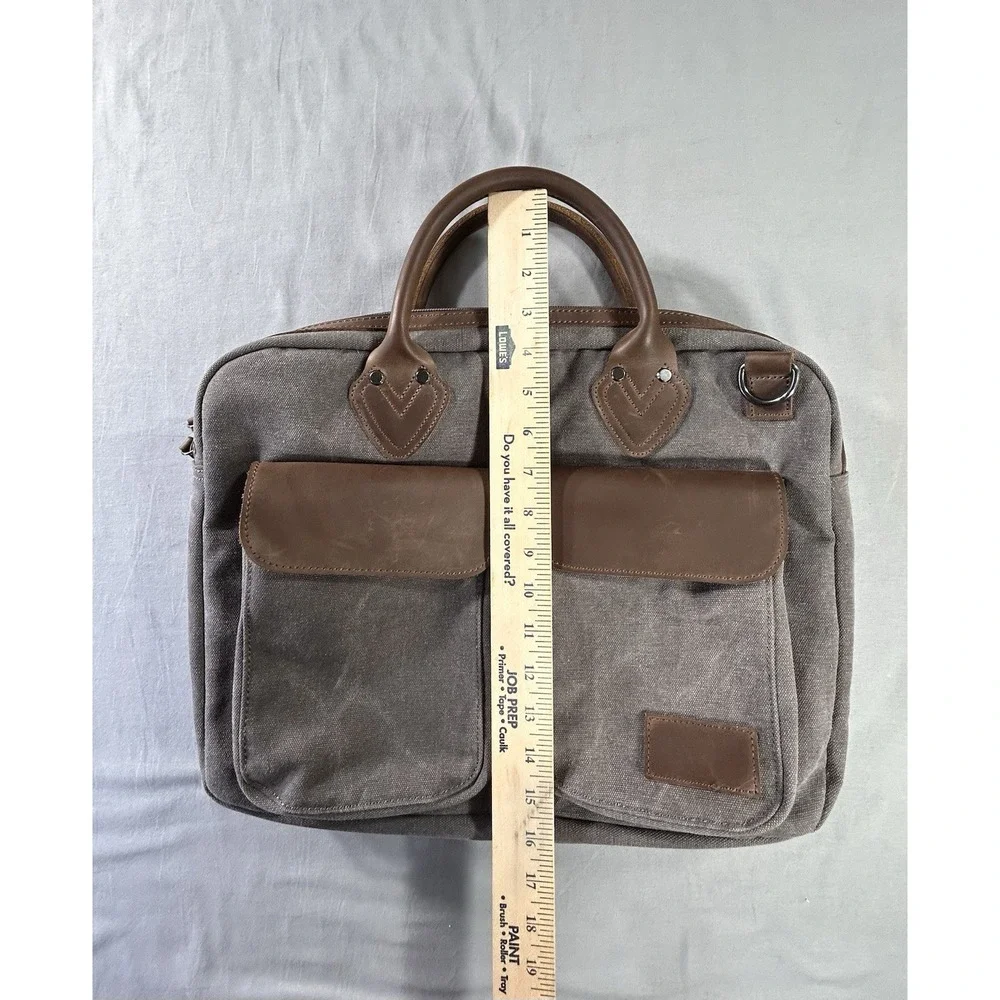 Renwick canvas briefcase featuring genuine leather trim missing shoulder strap